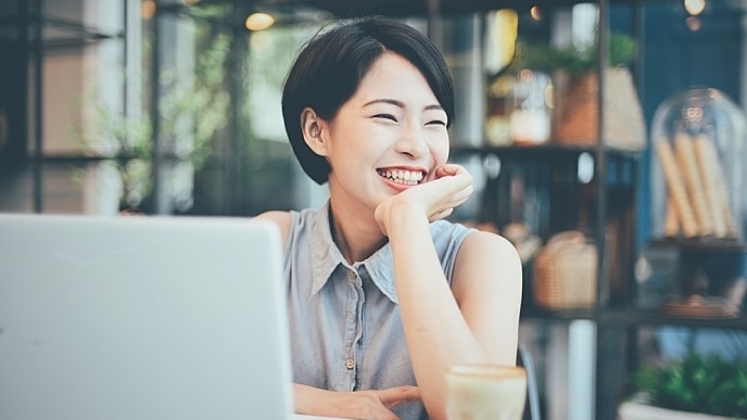 A young woman is smiling indoors